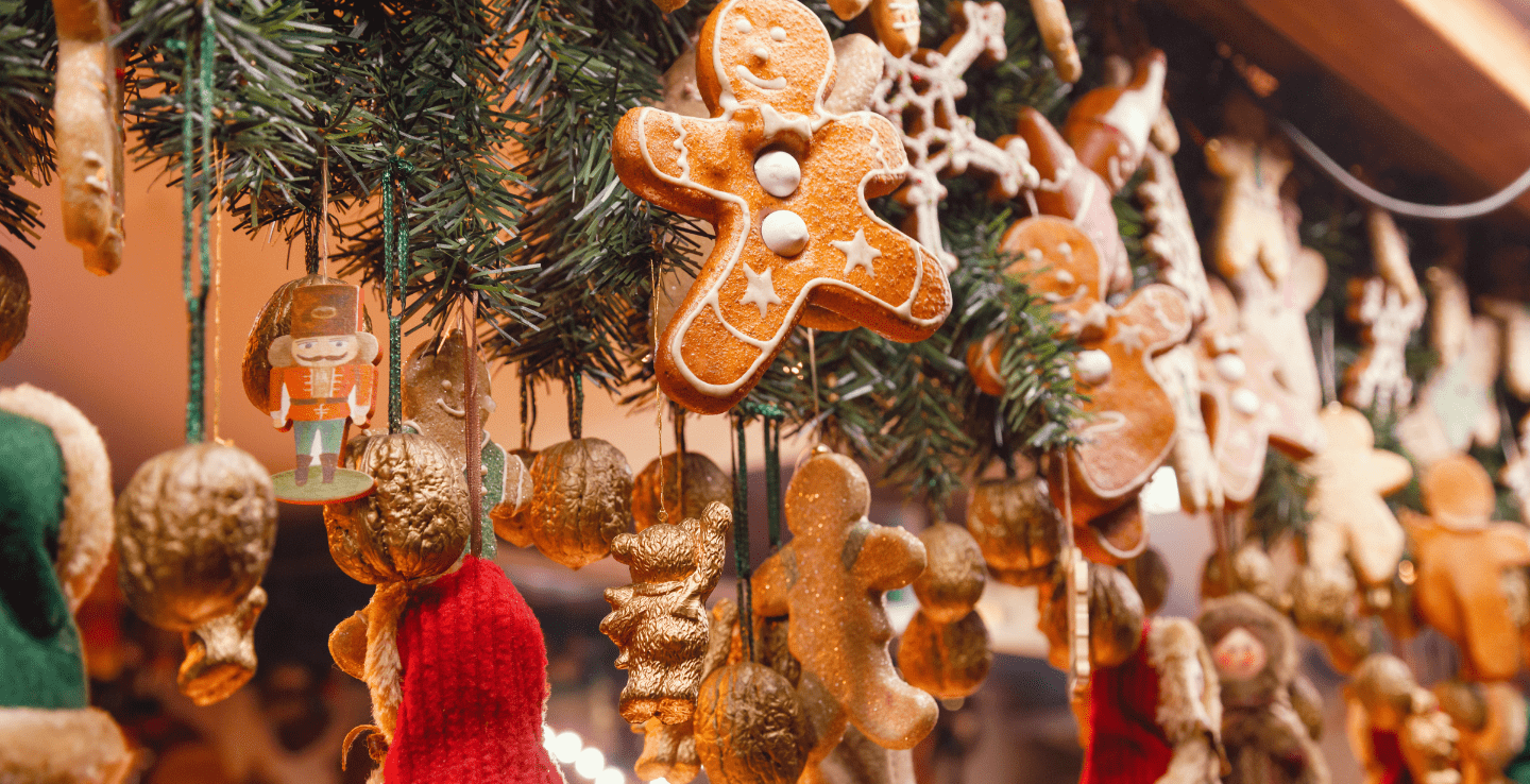 A gingerbread man on a Christmas tree with other decorations - great Christmas holiday ideas
